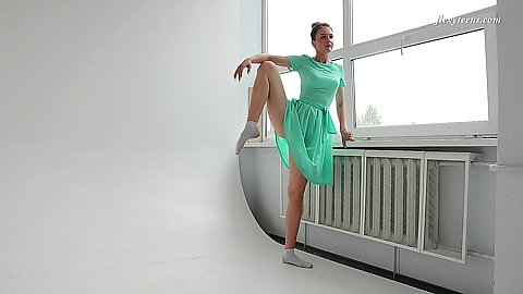 Green dress flexible young euro solo brunette Alla Sinichka stretching out for ballet