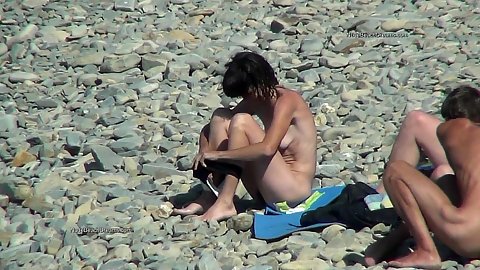 Public nude beach for happy nudist goers with mature and other aged women there