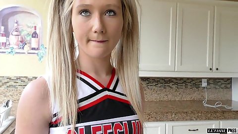 18 year old cheerleader in uniform in the kitchen talking and masturbating on camera April Aniston