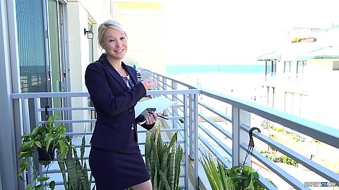 Blonde light skin milf on the balcony showing off the estate apartment she wants to sell Laura Bentley she is a horny cougar
