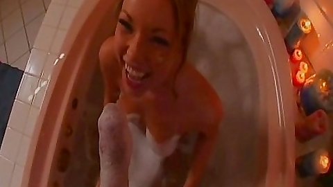 Hot babe sucks off her bf in the bathtub foam
