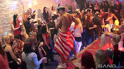 Dancing male stripper with horny girls watching him
