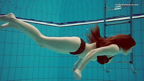 Solo redhead Vesta with trimmed twat diving naked underwater in a pool euro