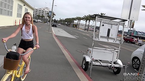 Riding around on a very vintage type yellow bicycle petite 18 year old no bra wearing youngster Kenzie Kai flashing her boobies while in public