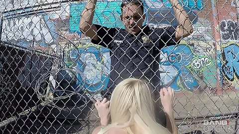 Cop finds a prostitute Skylar Madison doing her rounds he requests that she gives him head through a fense in public and then screws her standing fuck