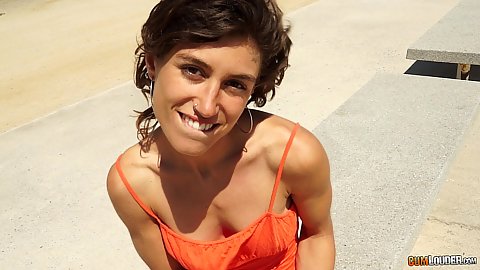 Smiling Spanish good looking girl in an orange dress in public Julia Roca not wearing a bra to attract more stranger males