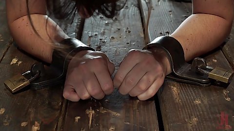 Device bondage Keira Croft hands are in shackles with a lock her are poked with a sharp metal object causing immense torment and pain