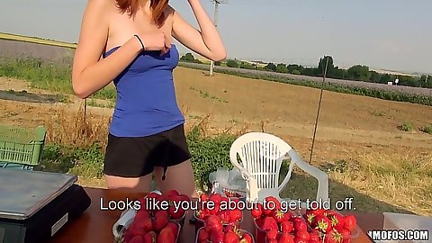 Linda Sweet picked up seling some fruits outdoors and has a cigarette smoke