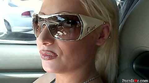Blonde pornstar Candy Manson driving around and stripping naked