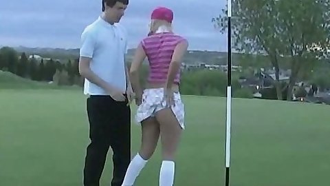 Playing some golf with nice looking teen outdoors in publics